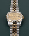 Rolex Datejust 16233 Champagne Dial - close-up van wijzerplaat en fluted bezel onder een hoek