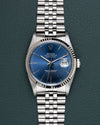 Rolex Datejust 16234 Blue Dial - frontaal aanzicht met blauwe wijzerplaat en witgouden fluted bezel